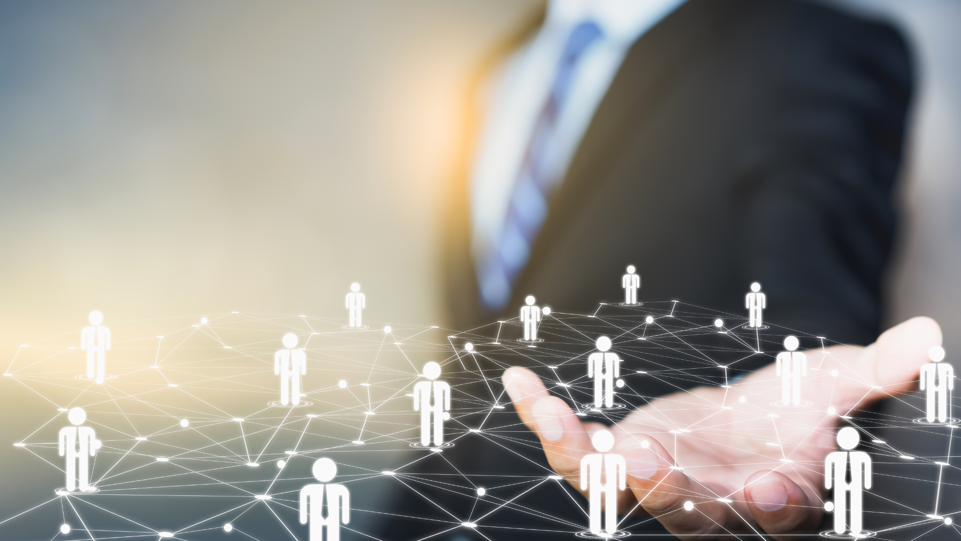 A man holding a graphic of a network of candidates, in a bright white light