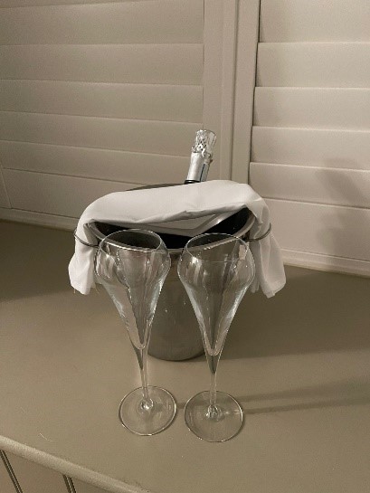 Champagne in a bucket with 2 glasses in front
