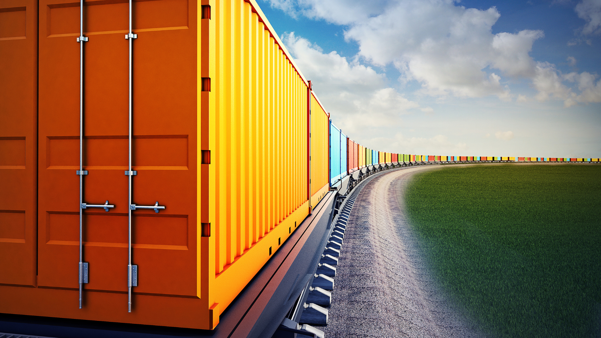 A long line of rail freight cars travelling past a green field