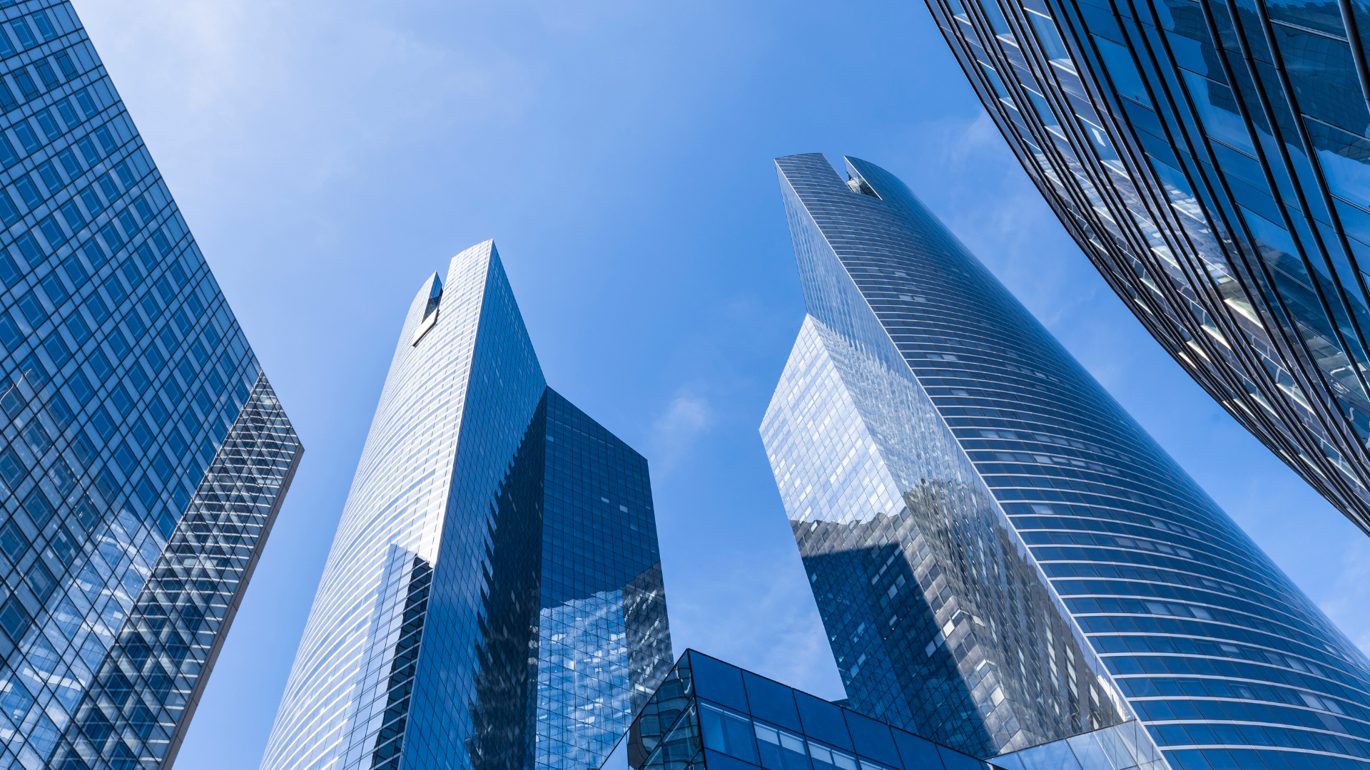 A view of a group of modern skyscrapers from below