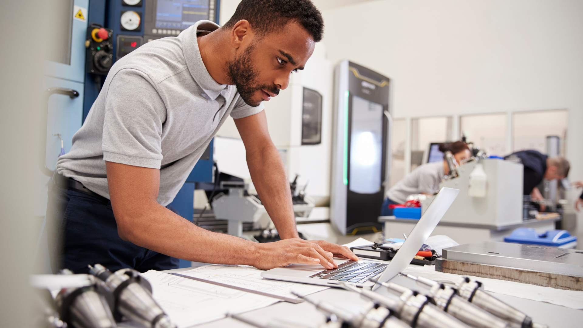 An engineer working on a laptop