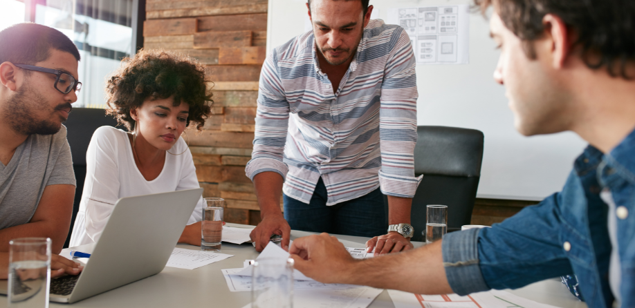 A group of employees discussing a project