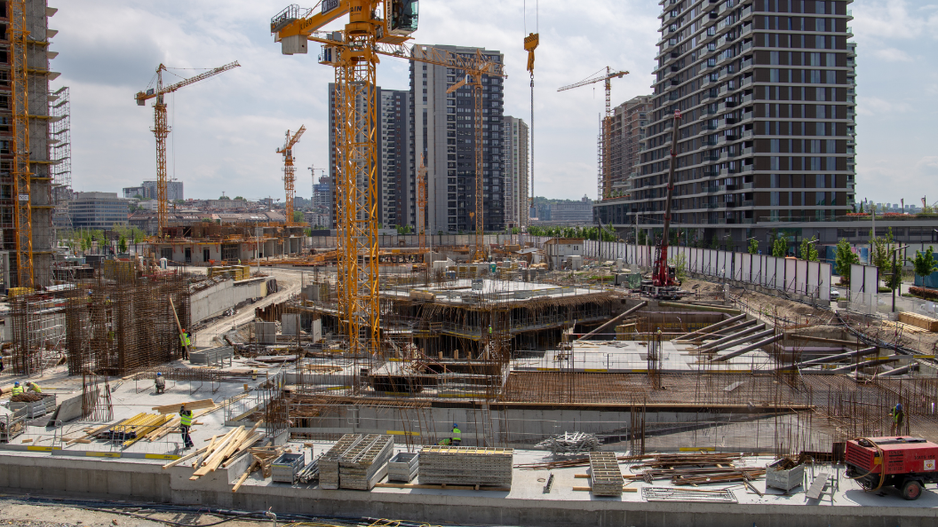 An image of a building under construction, it is one of many high rise buildings being built in an area