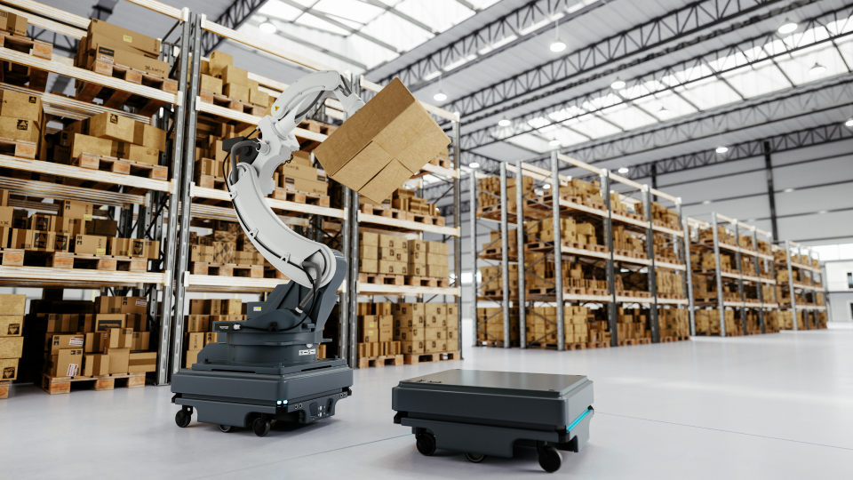 An image of a robotic arm placing a package on to a drone robot in a warehouse.