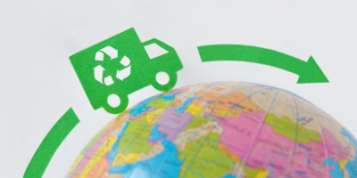 A van with a recycling logo travelling around a globe