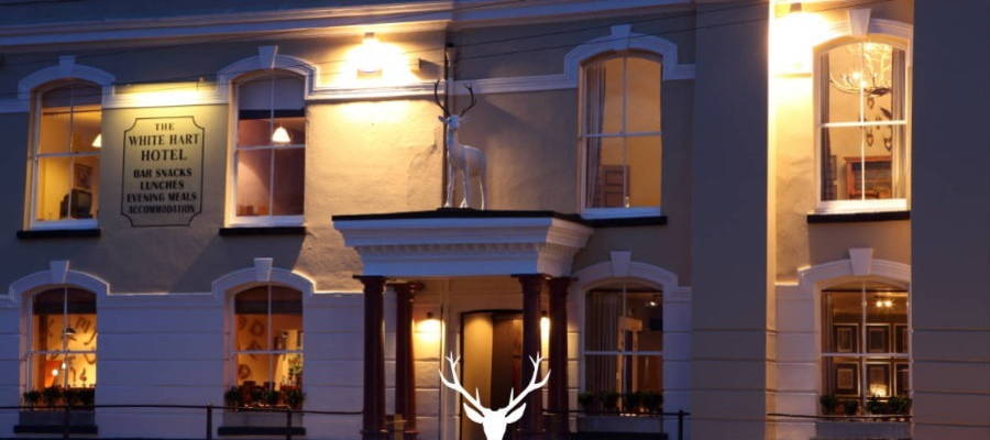 A close up shot of the White Hart Hotel in the evening