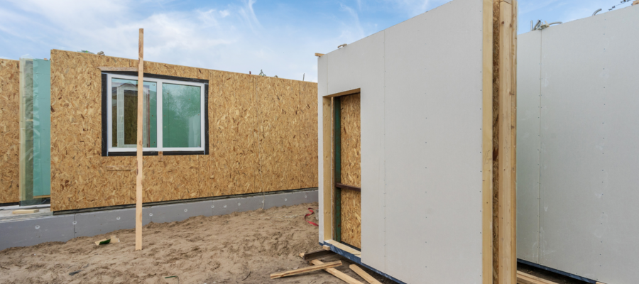 several pre-fabricated panels ready to be put together to make a building